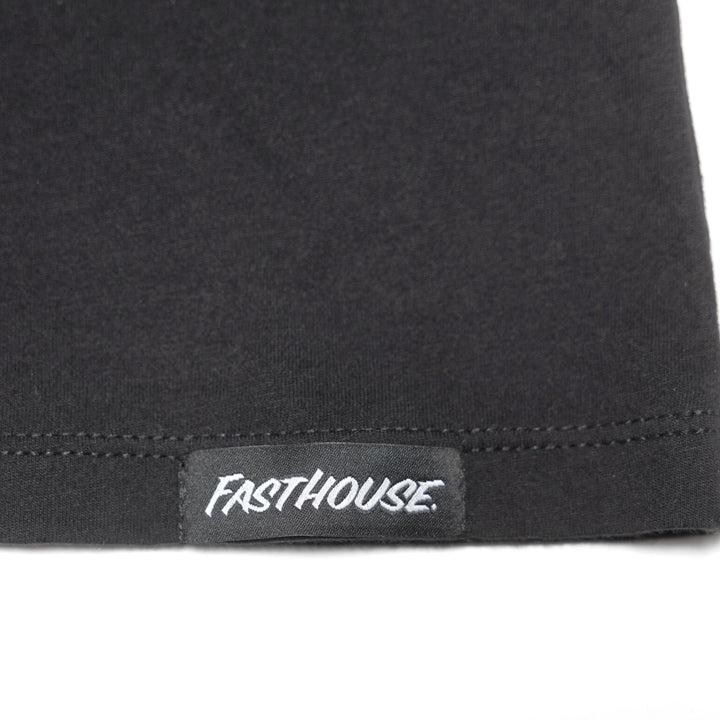 Fasthouse Women's Shadow Palms SS Tee Black - Close-Up of Brand Tag on Hem