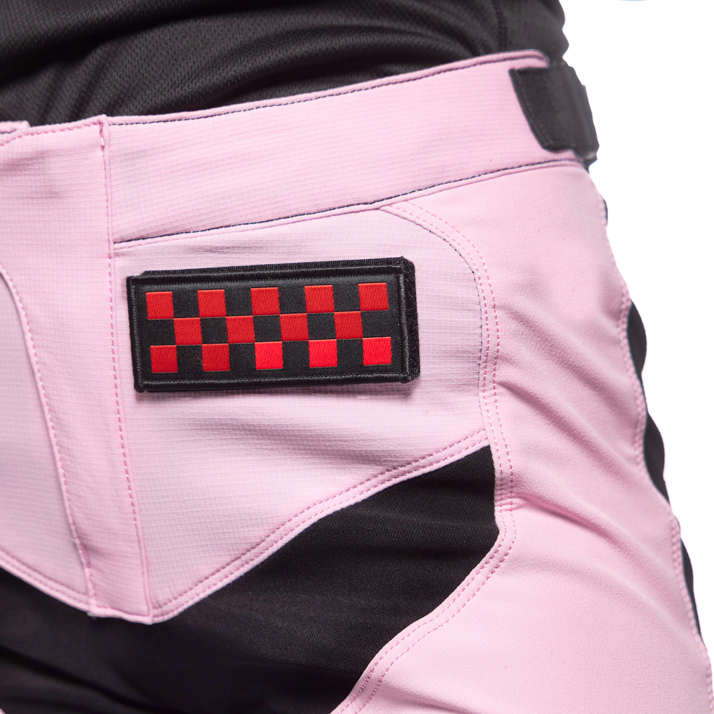 Fasthouse Women's Speed Style Karma Pant Pink Diamond/Black - Close-up of Left Side Graphic