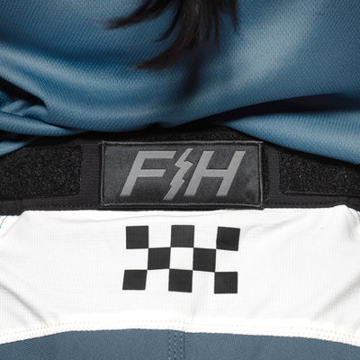 Fasthouse Women's Speed Style Anthem Pant White/Teal - Close-Up of Rear Waist Graphics and Details