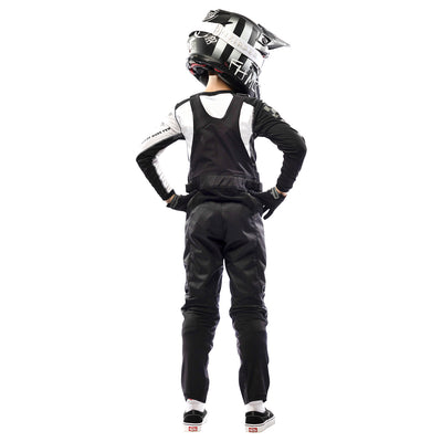 Fasthouse Youth Carbon Motorall Black - Rear View of Model Posing in Motoralls