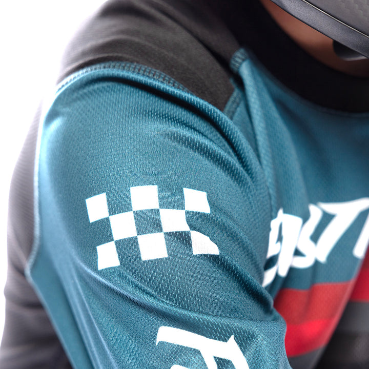 Fasthouse Youth Carbon Force Jersey Teal - Close-Up of Upper Right Sleeve Graphics