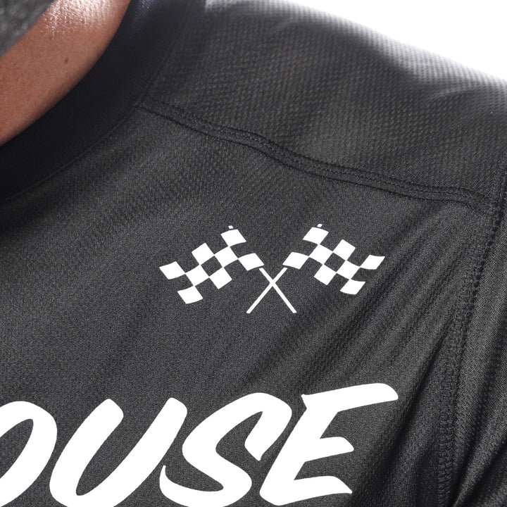 Fasthouse Youth Carbon Method Jersey Black/Gray - Close-Up of Front Left Shoulder Graphics