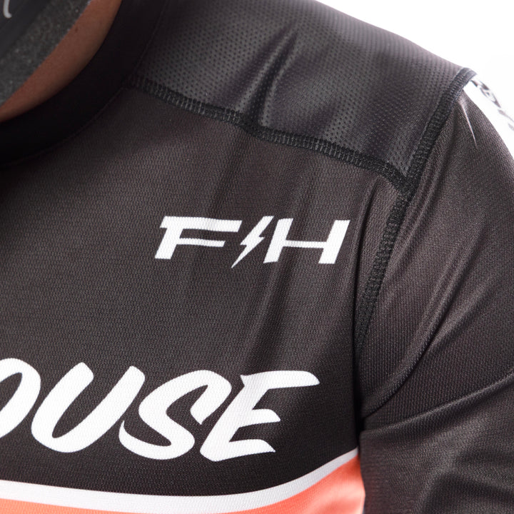 Fasthouse Youth Elrod Formula Jersey Oceanic Mint/Hyper Coral - Close-Up of Left Front Shoulder Graphics