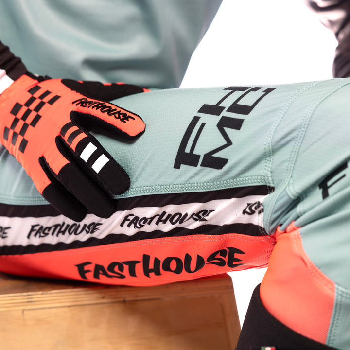 Fasthouse Youth Elrod Formula Pants Oceanic Mint/Hyper Coral - Close-Up of Right Thigh Graphics