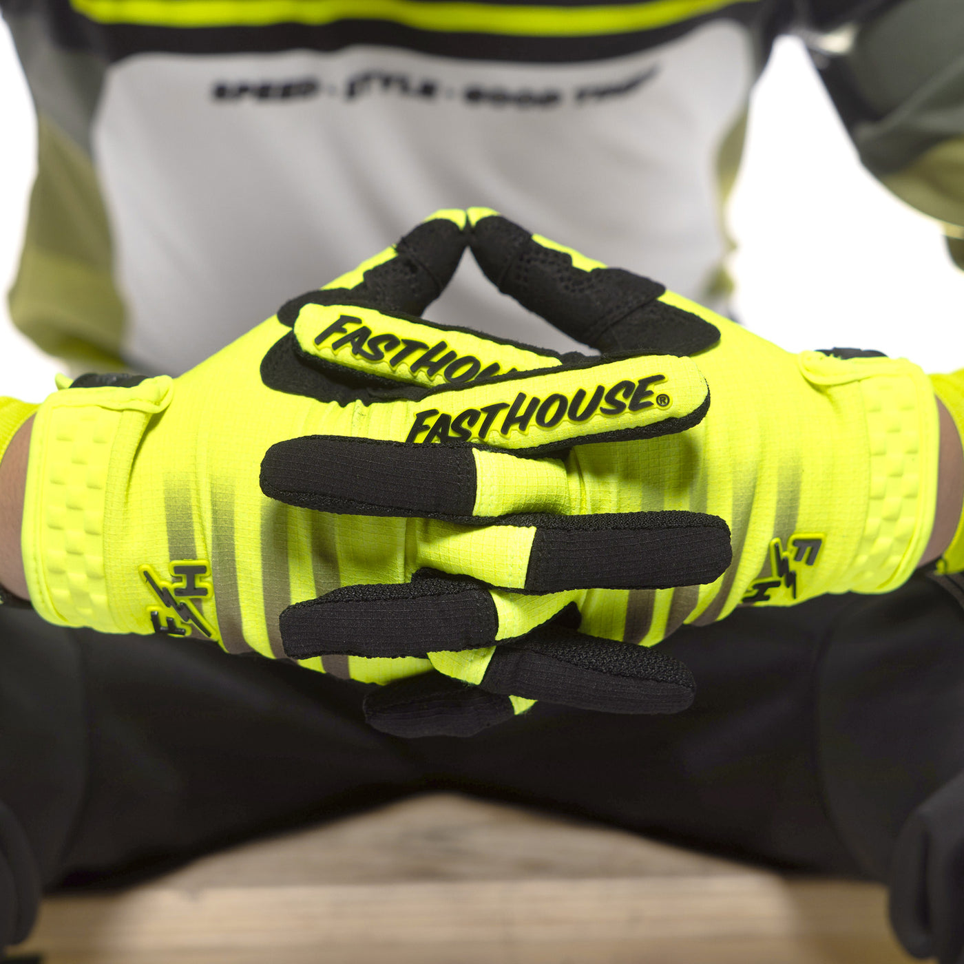 Fasthouse Youth Elrod Hypersonic Gloves Hi-Viz - Close-Up of Gloved Hands with Fingers Entwined