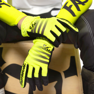 Fasthouse Youth Elrod Hypersonic Gloves Hi-Viz - Close-Up of Gloved Hands Criss-Crossed