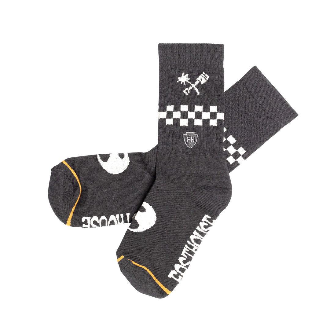 Fasthouse Youth Gold Mine Crew Socks Black - Side View of Pair, Criss-Crossed One Over the Other