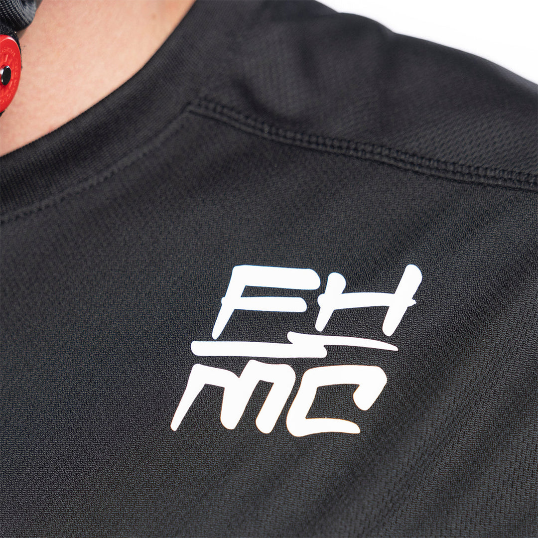 Fasthouse Youth Grindhouse Hot Wheels Jersey White/Black - Close-Up of Left Shoulder Chest Graphic