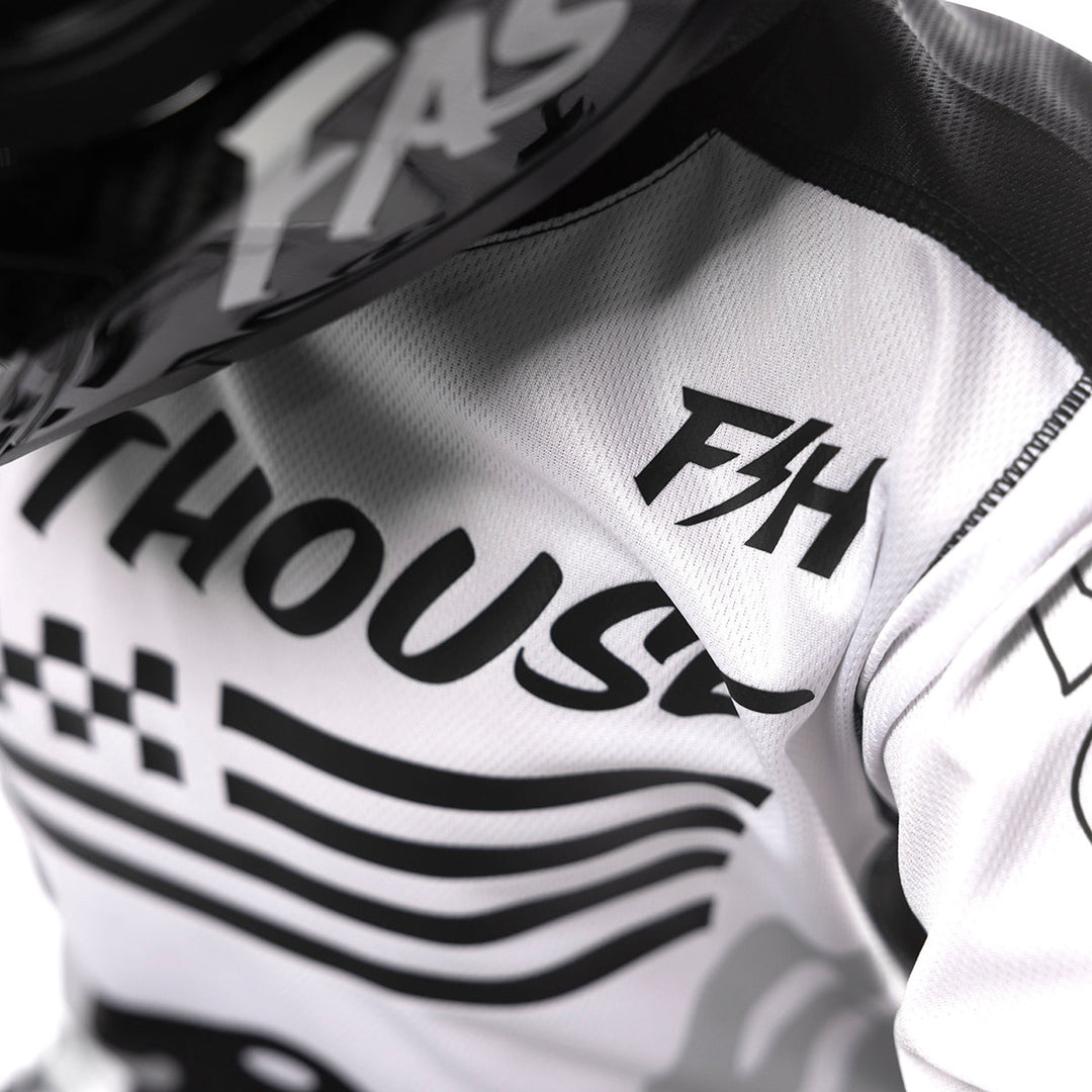 Fasthouse Youth Grindhouse Riot Jersey White/Black - Close-up of Shoulder Chest Graphic
