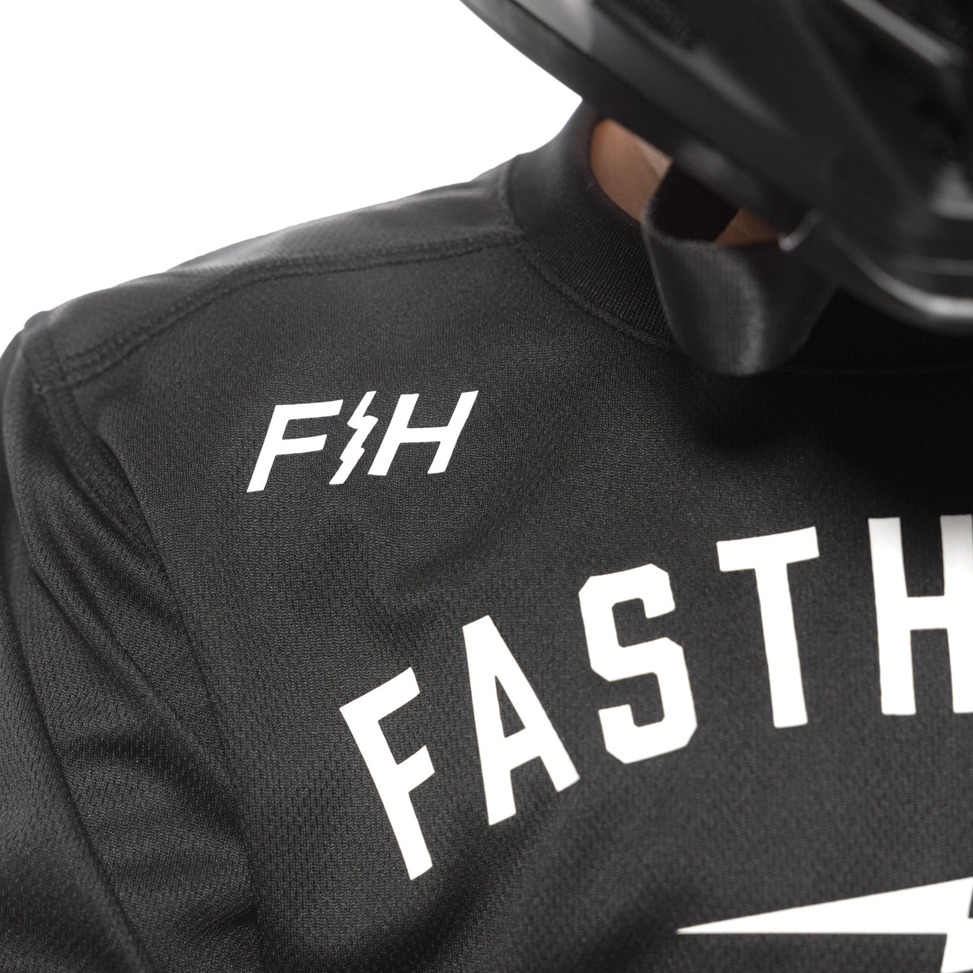 Fasthouse Youth Grindhouse Grit Jersey Black - Close-Up of Shoulder Chest Graphic