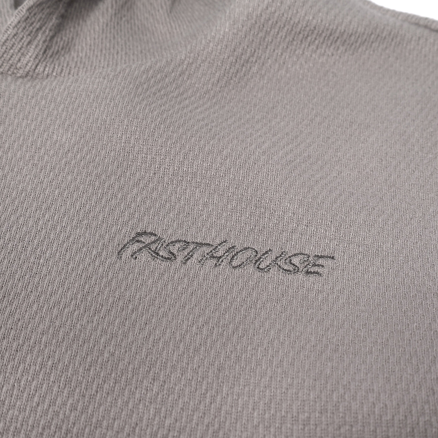 Fasthouse Youth Robin Hooded Thermal Cloud Gray - Close-Up of Stitched Logo on Front Chest
