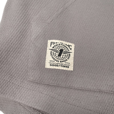 Fasthouse Youth Robin Hooded Thermal Cloud Gray - Close-Up of Patch Label on Kangaroo Pocket