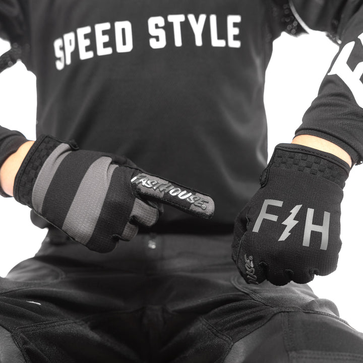 Fasthouse Youth Speed Style Akin Gloves Black/Gray - Close-Up of One Gloved Hand Pointing at Back of Other Gloved Hand