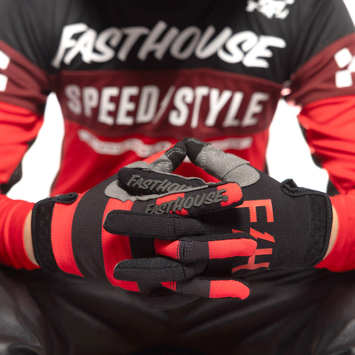 Fasthouse Youth Speed Style Akin Gloves Black/Red - Close-up of Gloved Hand with Fingers Entwined
