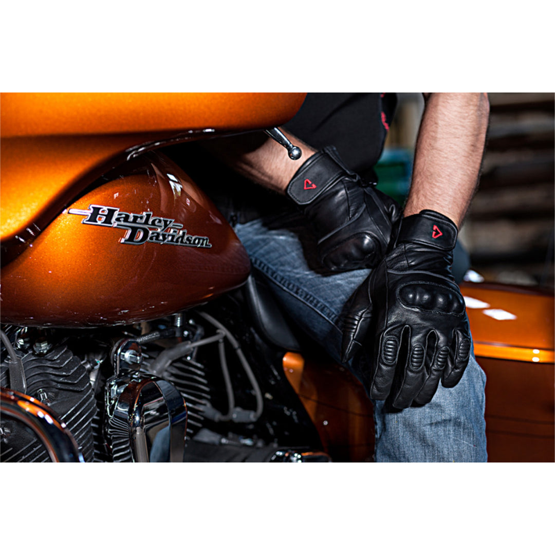 GERBING HEATED CLOTHING 12V Vanguard Heated Gloves Black - Lifestyle Close-Up of Rider Wearing Gloves on Orange Motorcycle