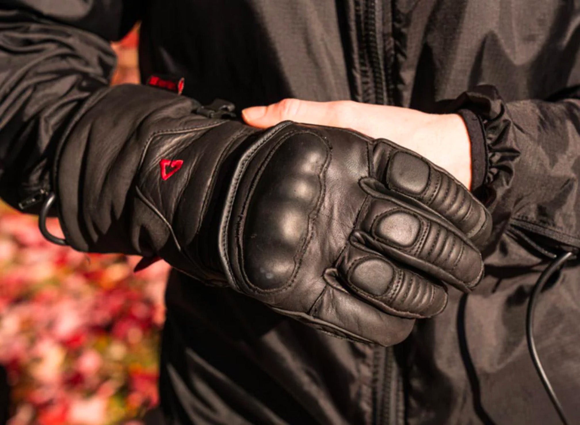 Lifestyle Close-Up of Rider Putting on GERBING HEATED CLOTHING 12V Vanguard Heated Gloves