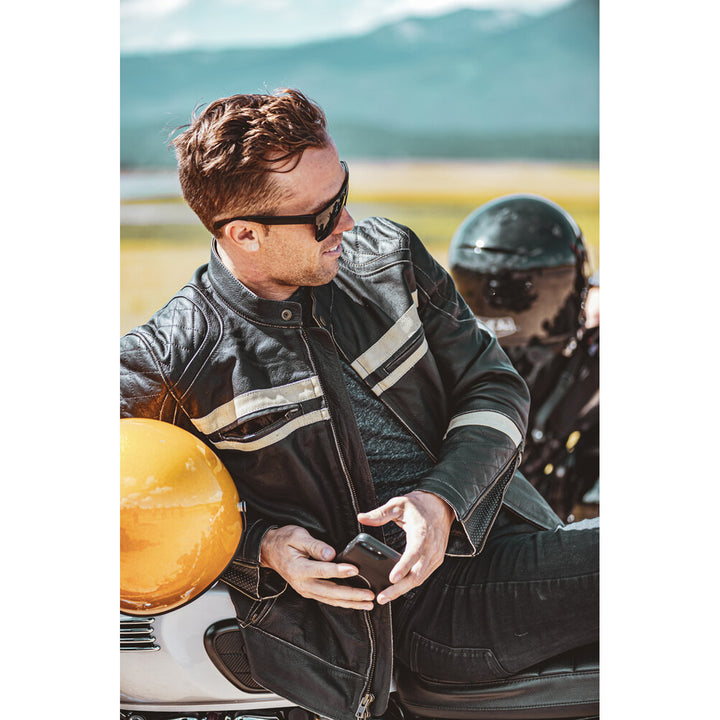 Highway 21 Motordrome Jacket Antique Black - Lifestyle Shot of Rider Relaxing on Motorcycle while Wearing Jacket