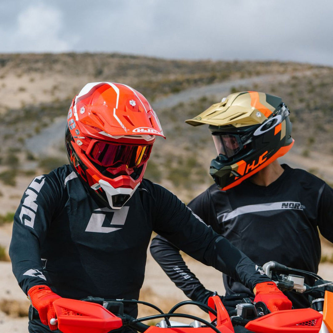 HJC C50 Primal Helmet MC-1 and MC-6HSF - Lifestyle Shot of Two Dirt Bike Riders Wearing Helmets While Getting Ready to Ride