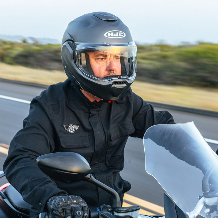 HJC F100 Solid Helmet Semi-Flat Black - Lifestyle Close-Up of Rider Wearing Helmet while riding Motorcycle