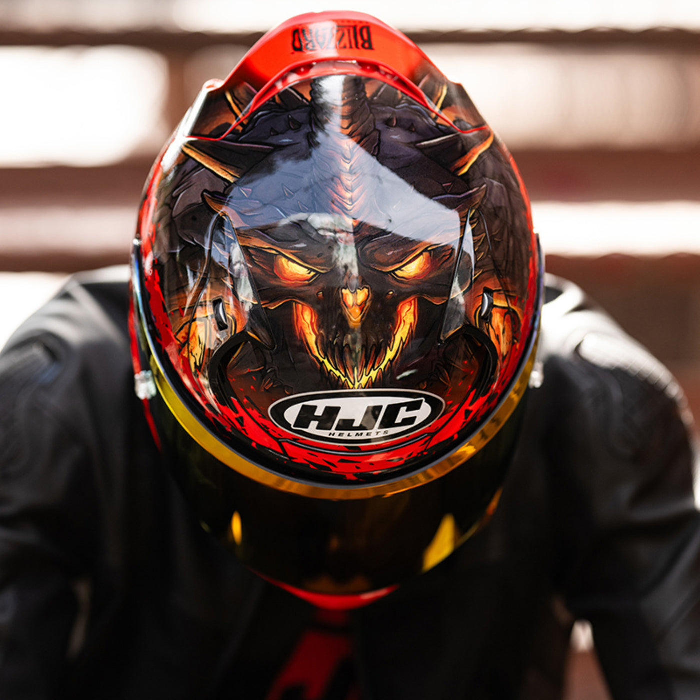 HJC RPHA 12 Diablo Blizzard Helmet MC-1 - Lifestyle of Rider Leaning Forward, showing top of helmet