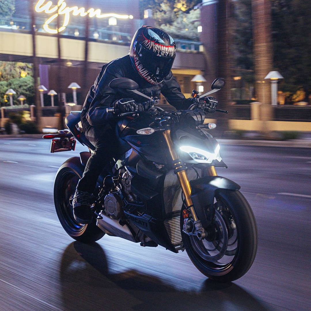 HJC RPHA 12N Venom III Helmet MC-1SF - Lifestyle of Rider Wearing Helmet While Riding Motorcycle through Night-Lit City