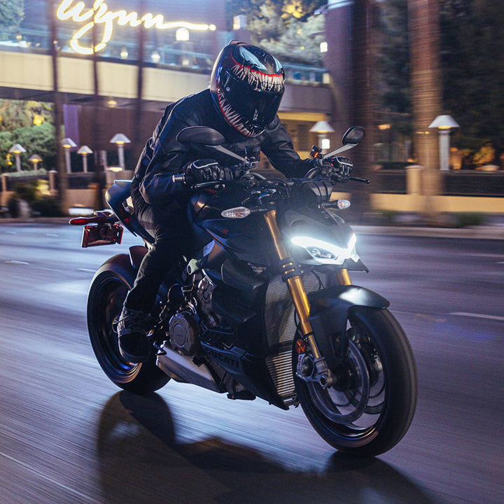 HJC RPHA 12N Venom III Helmet MC-1SF - Lifestyle of Rider Wearing Helmet While Riding Motorcycle through Night-Lit City