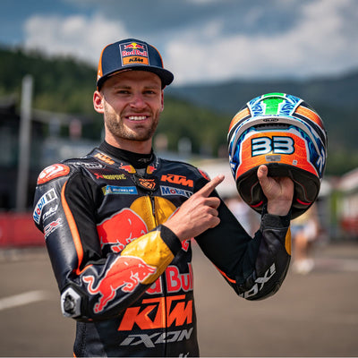 HJC RPHA 1N Brad Binder Helmet MC-27SF - Lifestyle Shot of Brad Binder Holding up Helmet and Pointing at 33 Printed on Back