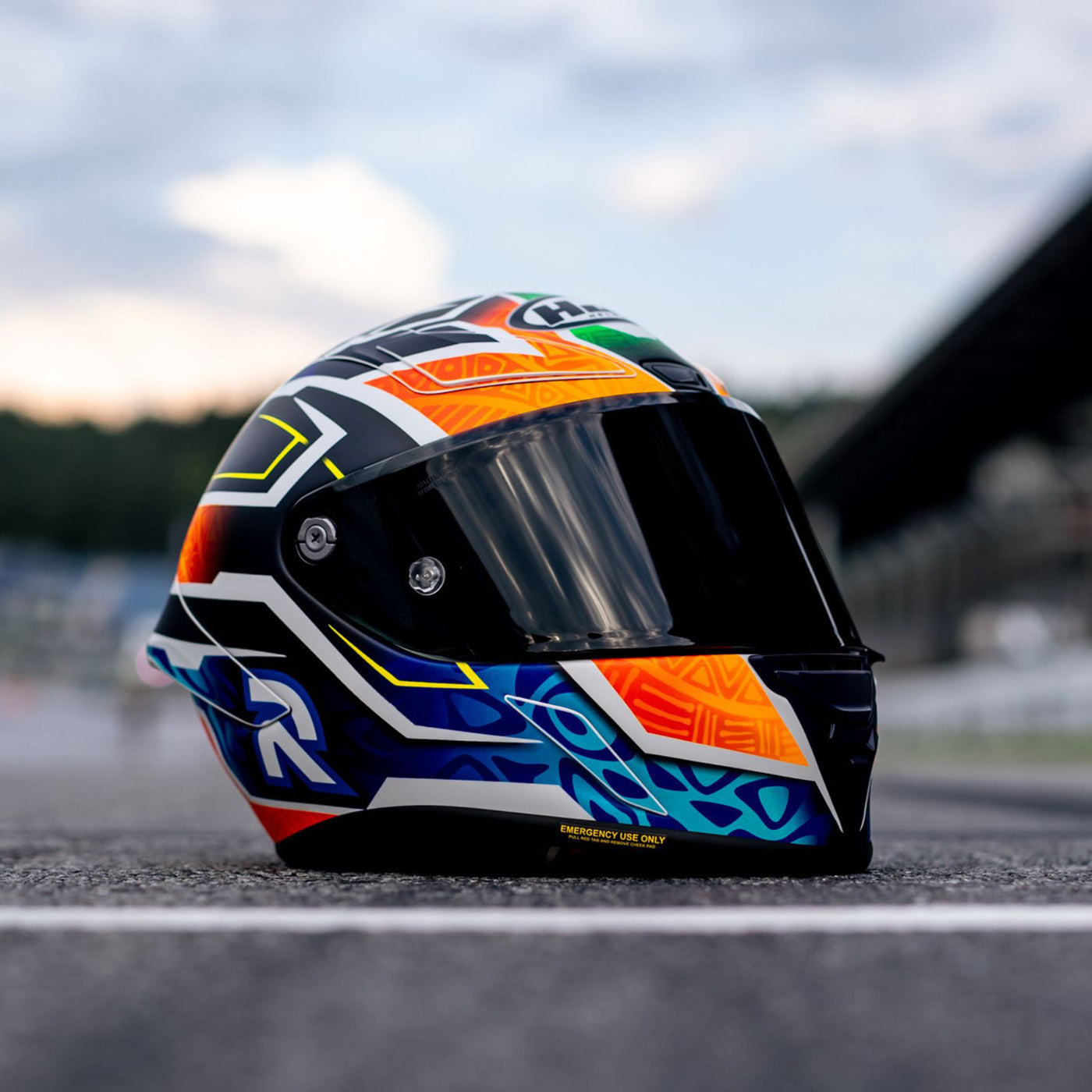 HJC RPHA 1N Brad Binder Helmet MC-27SF - Lifestyle Shot of Helmet Resting on Track, Right Side View