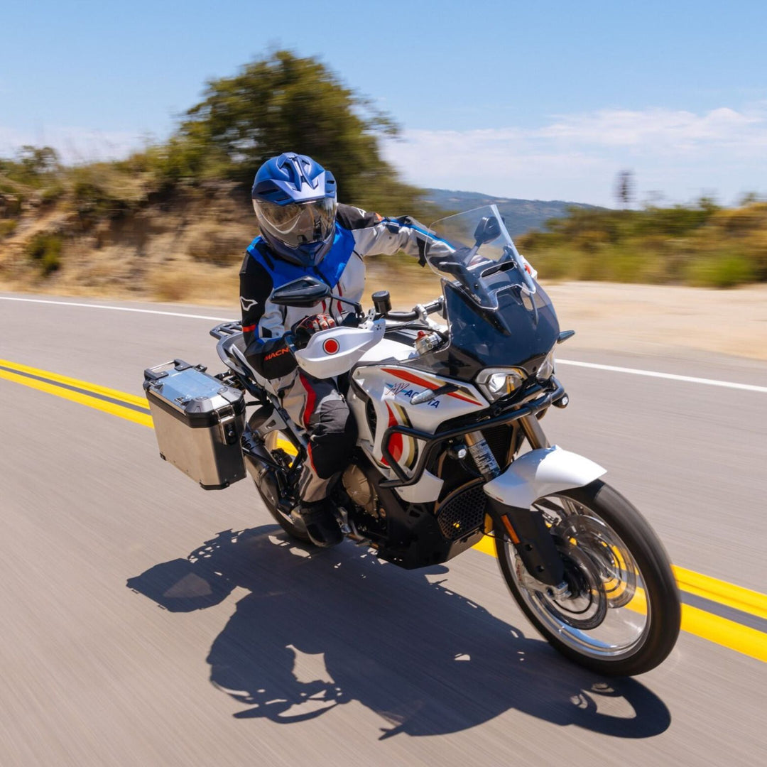 HJC RPHA 60 Solid Helmet Semi-Flat Metallic Blue - Lifestyle Shot of Adventure Motorcycle Rider in Helmet coming through road turn