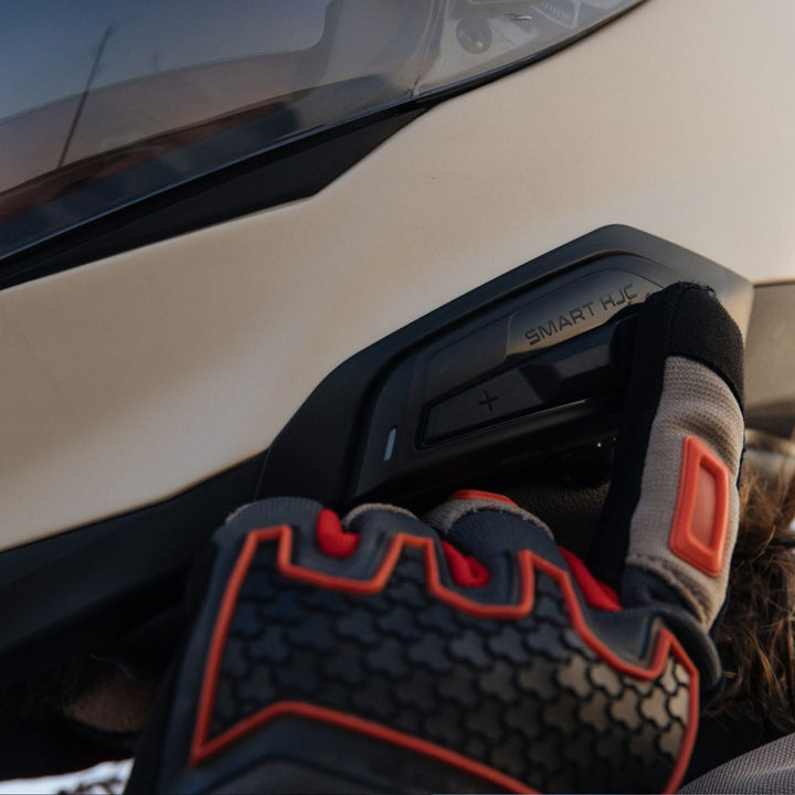 HJC RPHA 60 Solid Helmet Sand Beige - Lifestyle Close-Up of Rider Using Smart HJC System installed into helmet