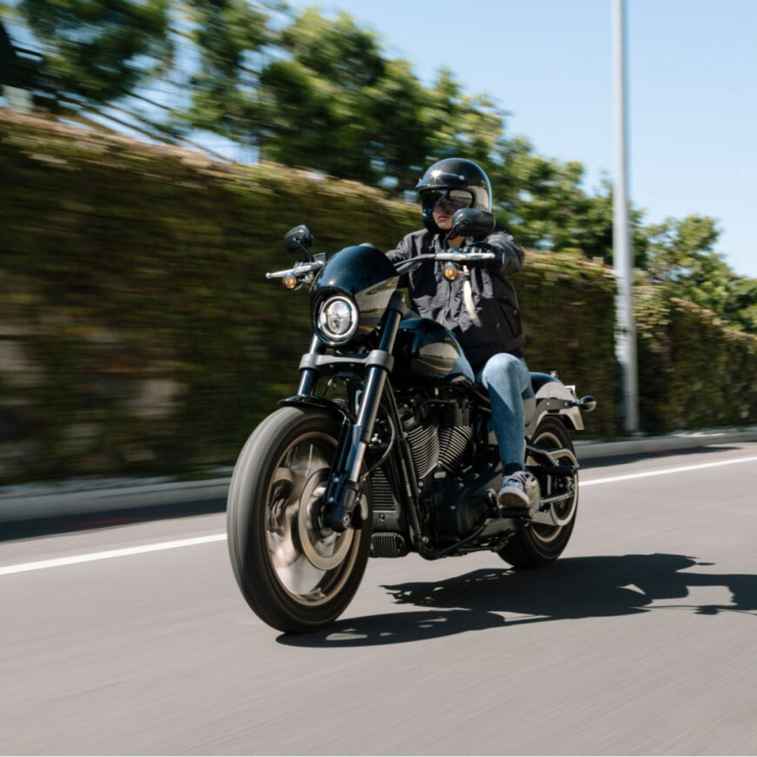 HJC V31 Solid Helmet Black - Lifestyle Shot of Rider Wearing Helmet Riding Black Motorcycle