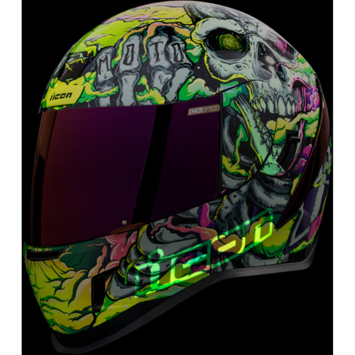 ICON Airform Hippy Dippy Helmet Purple - Front Left Side View with Dark Studio Background and Glow-in-the-Dark Graphics