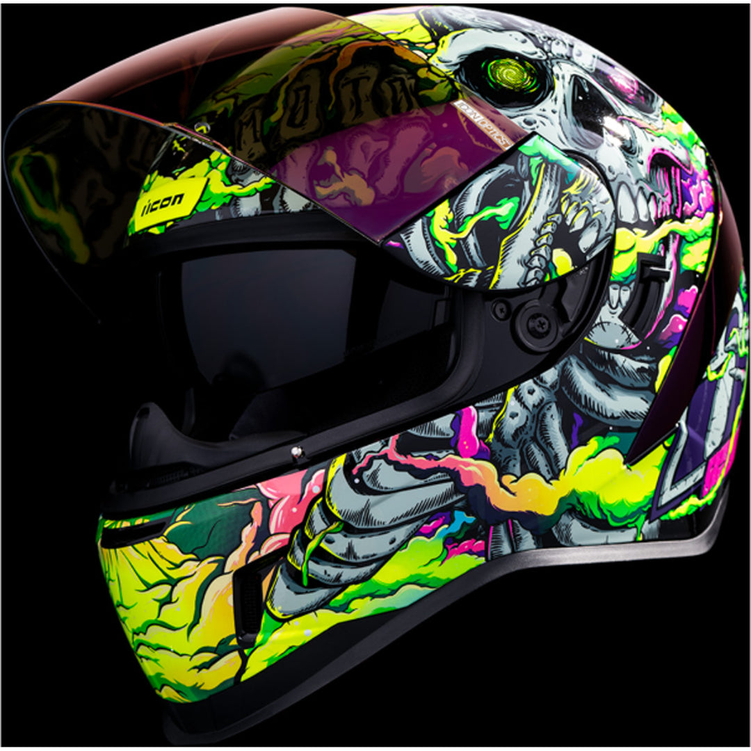 ICON Airform Hippy Dippy Helmet Purple - Close-Up of Front Left Side View with Dark Studio Background, Faceshield Raised, and Drop Down Sun Visor Lowered