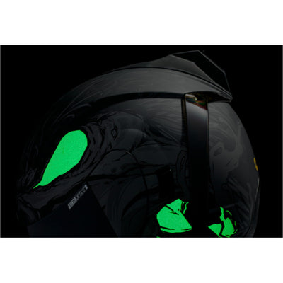 ICON Airform Manik'RR MIPS Helmet Dark Black - Close-Up of Left Side Details with Glow-in-the-Dark Graphics