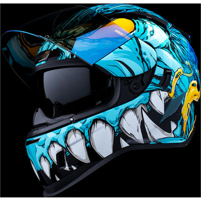 ICON Airform Manik'RR MIPS Helmet Light Blue - Front Left Side View with Dark Studio Background, Faceshield Raised, and Drop Down Sun Visor Lowered