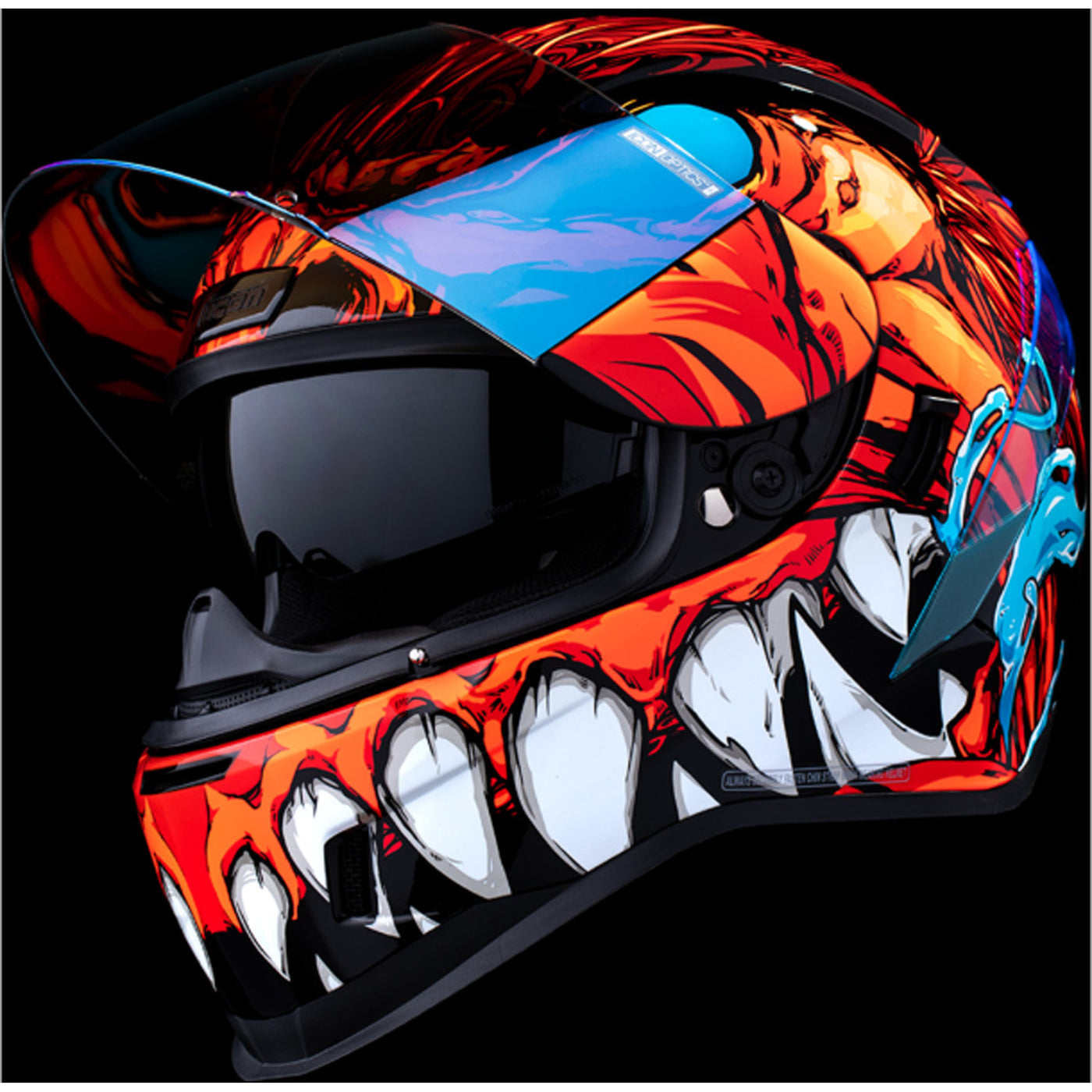 ICON Airform Manik'RR MIPS Helmet Red - Front Left Side View with Dark Studio Background, Faceshield Raised, and Drop Down Sun Visor Lowered