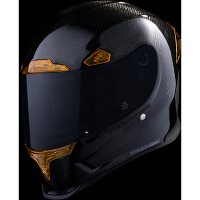 ICON Airframe Pro Carbon 4Tress Helmet Yellow - Front Left Side View with Dark Studio Background