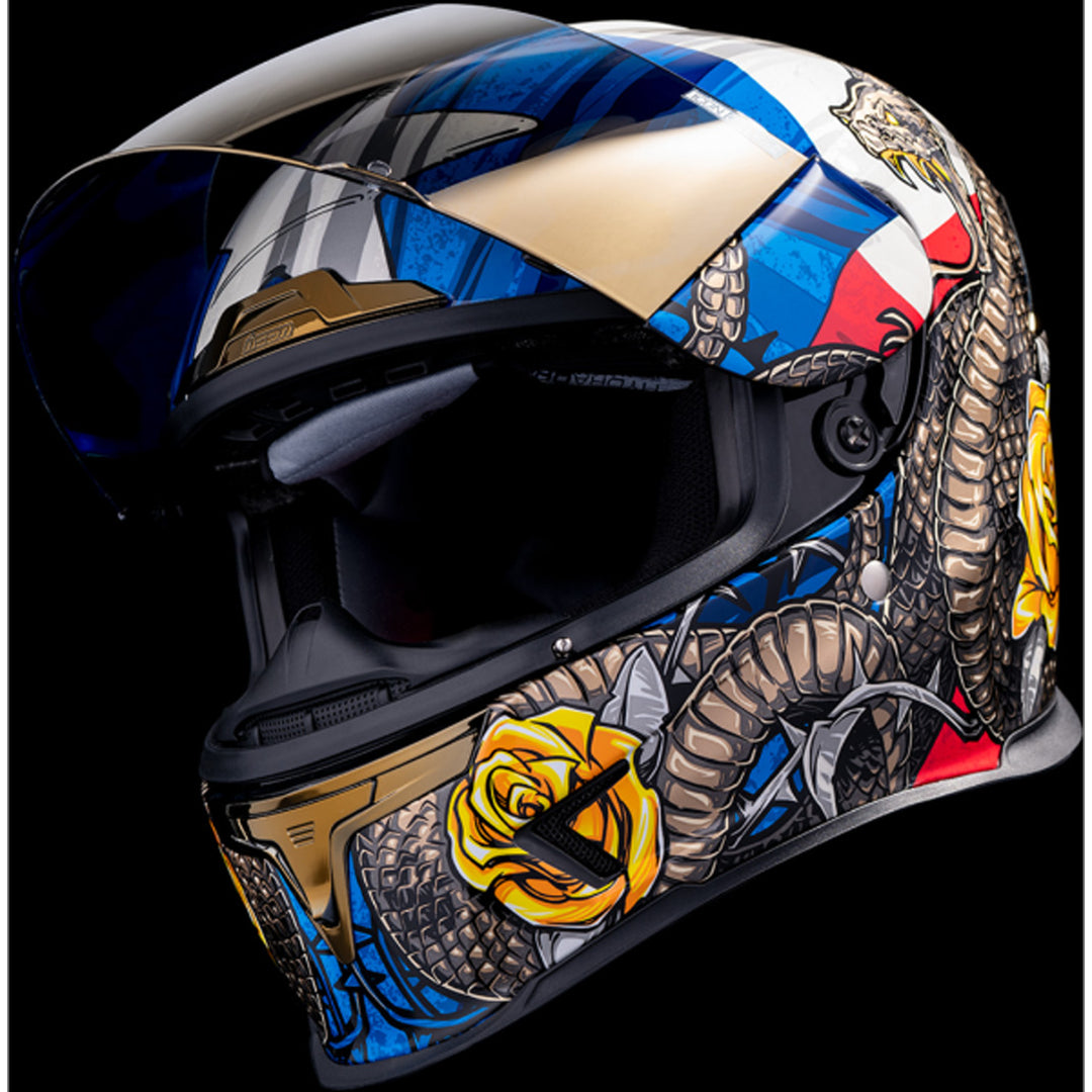 ICON Airframe Pro Tejas Libre Helmet Glory - Front Left Side View with Dark Studio Background and Faceshield Raised