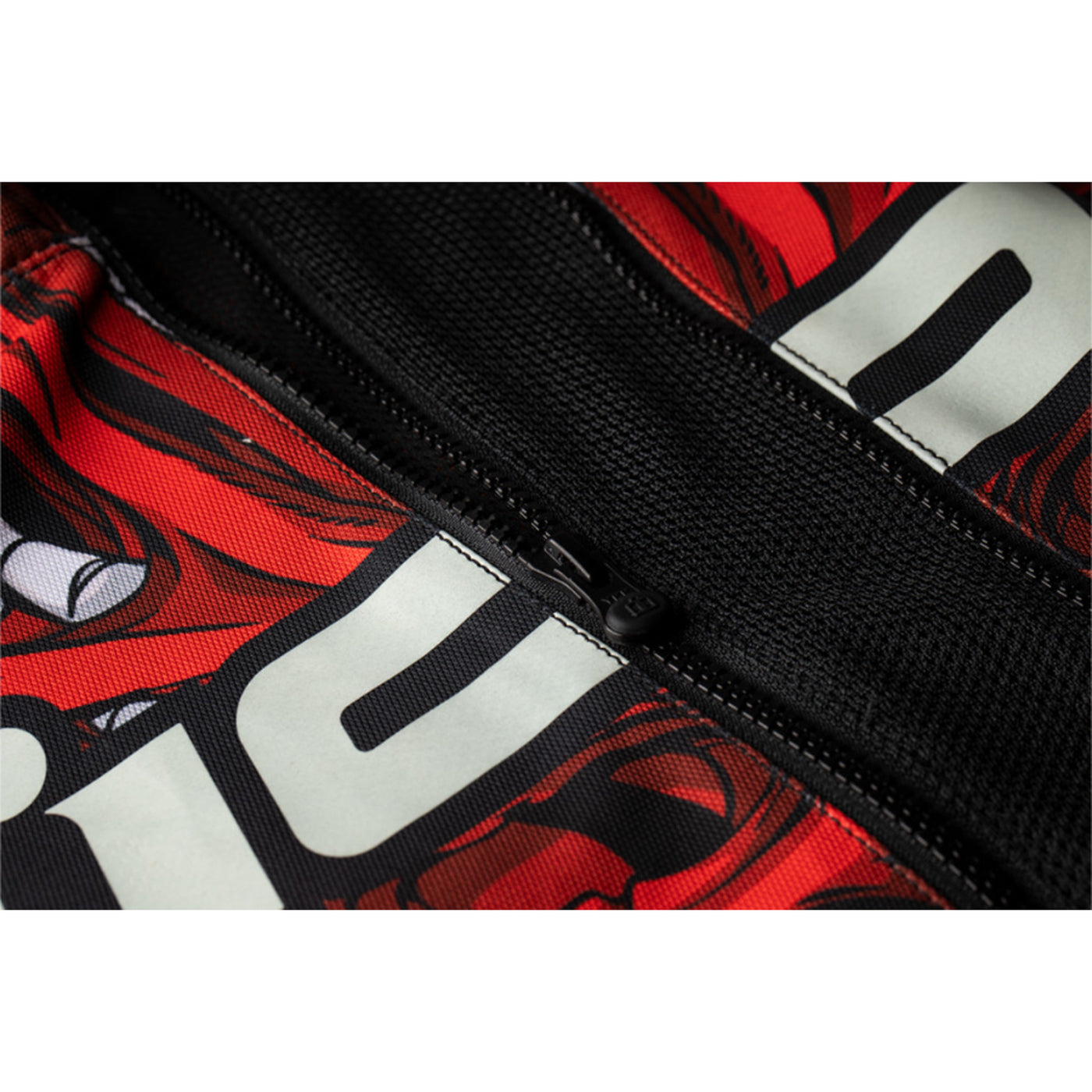 ICON Airform Manik'r Jacket Red - Close-Up of Expanded Mesh in Front Zipper at Midsection