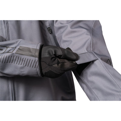 ICON PDX3 Jacket Gray - Close-Up of Model Adjusting Arm Strap