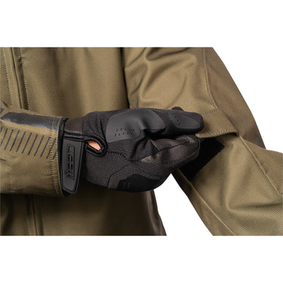 ICON PDX3 Jacket Olive - Close-Up of Model Adjusting Arm Strap