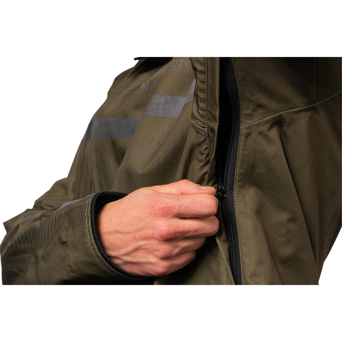 ICON PDX3 Jacket Olive - Close-Up of Model Zipping Armpit Vent