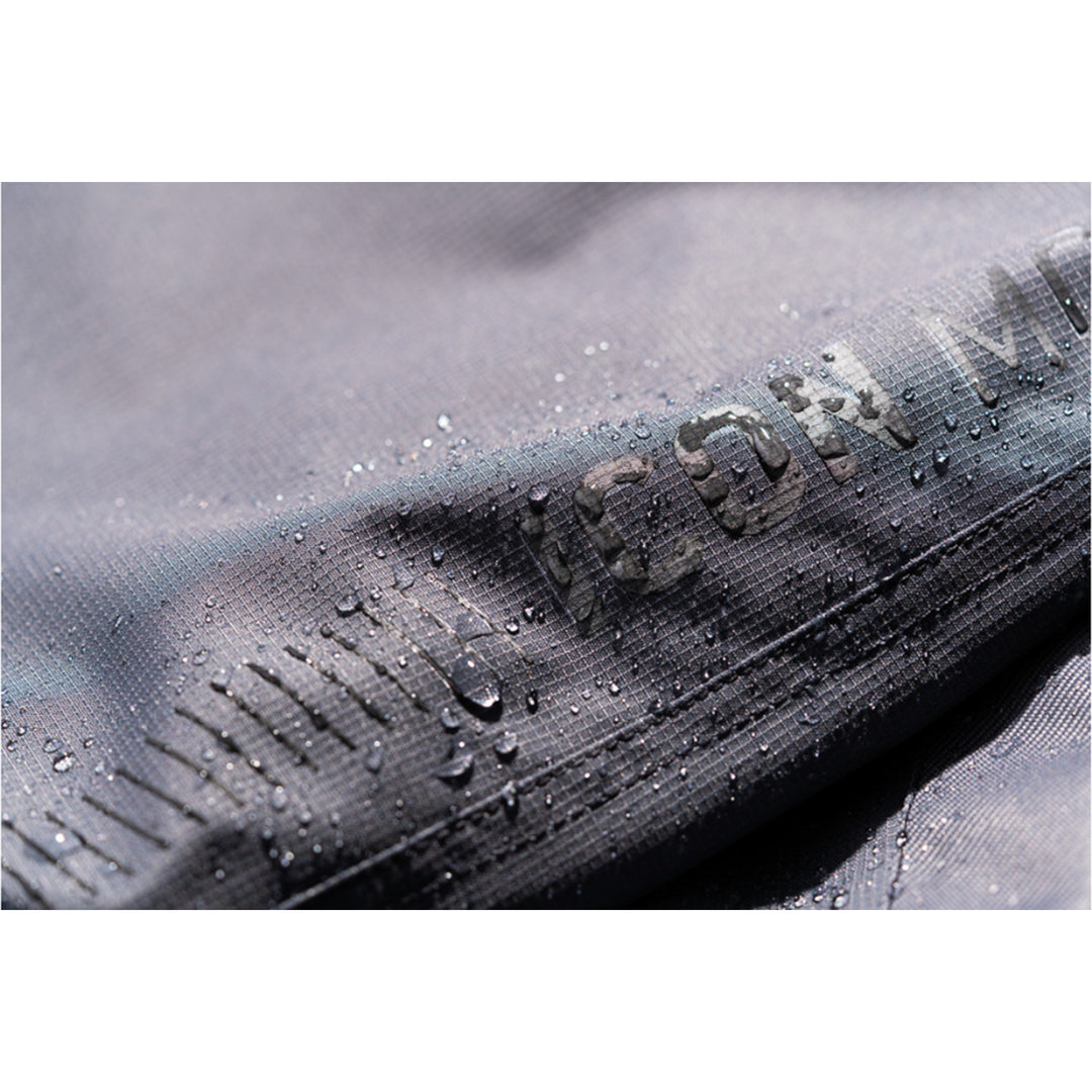 ICON PDX3 Overpant Gray - Close-Up of Waterproof Material with Logo Graphic
