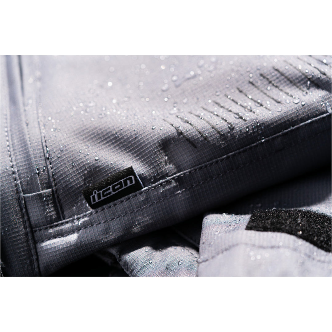 ICON PDX3 Overpant Gray - Close-Up of Waterproof Material with Logo Tag Sewn into Seam