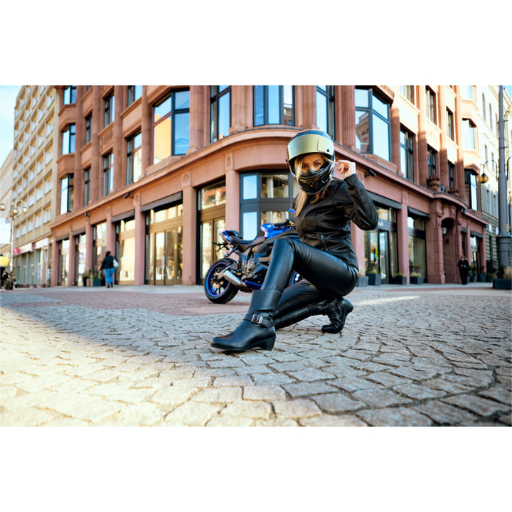 ICON Women's Tuscadero Boots Black - Lifestyle Shot of Model Kneeling in Boots