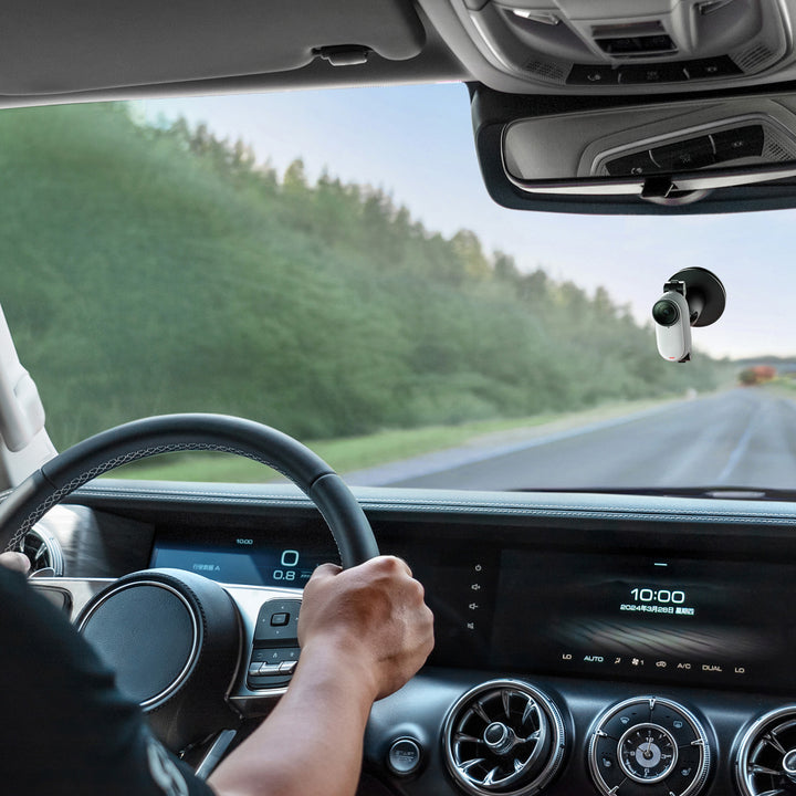 Insta360 GO 3S Action Bundle - Lifestyle Shot of Camera Mounted on Inside of Car Windshield