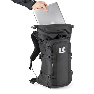 Kriega R22 Backpack - Front View with Model Placing Laptop into Open Top Section