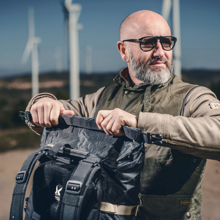 Kriega R30 Backpack - Lifestyle of Rider Rolling Top Section Closed