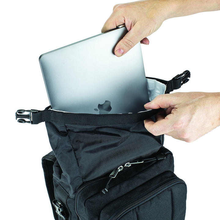 Kriega Sling Pro Messenger Bag - Close-Up of Model Placing Laptop into Top Section