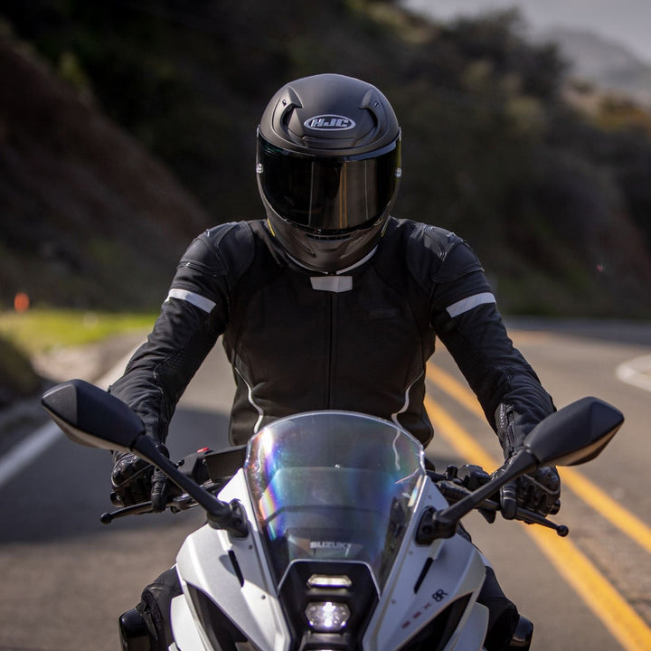 Noru Twenty-Eight 1-Piece Race Suit Black/White - Lifestyle Head-On Shot of Rider in Suit on Motorcycle